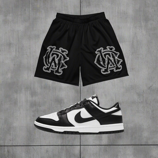 Model wearing Wolves Cry Originals OG Mesh Shorts Black & White Classic Edition, styled for a bold streetwear look with versatile and sustainable performance.