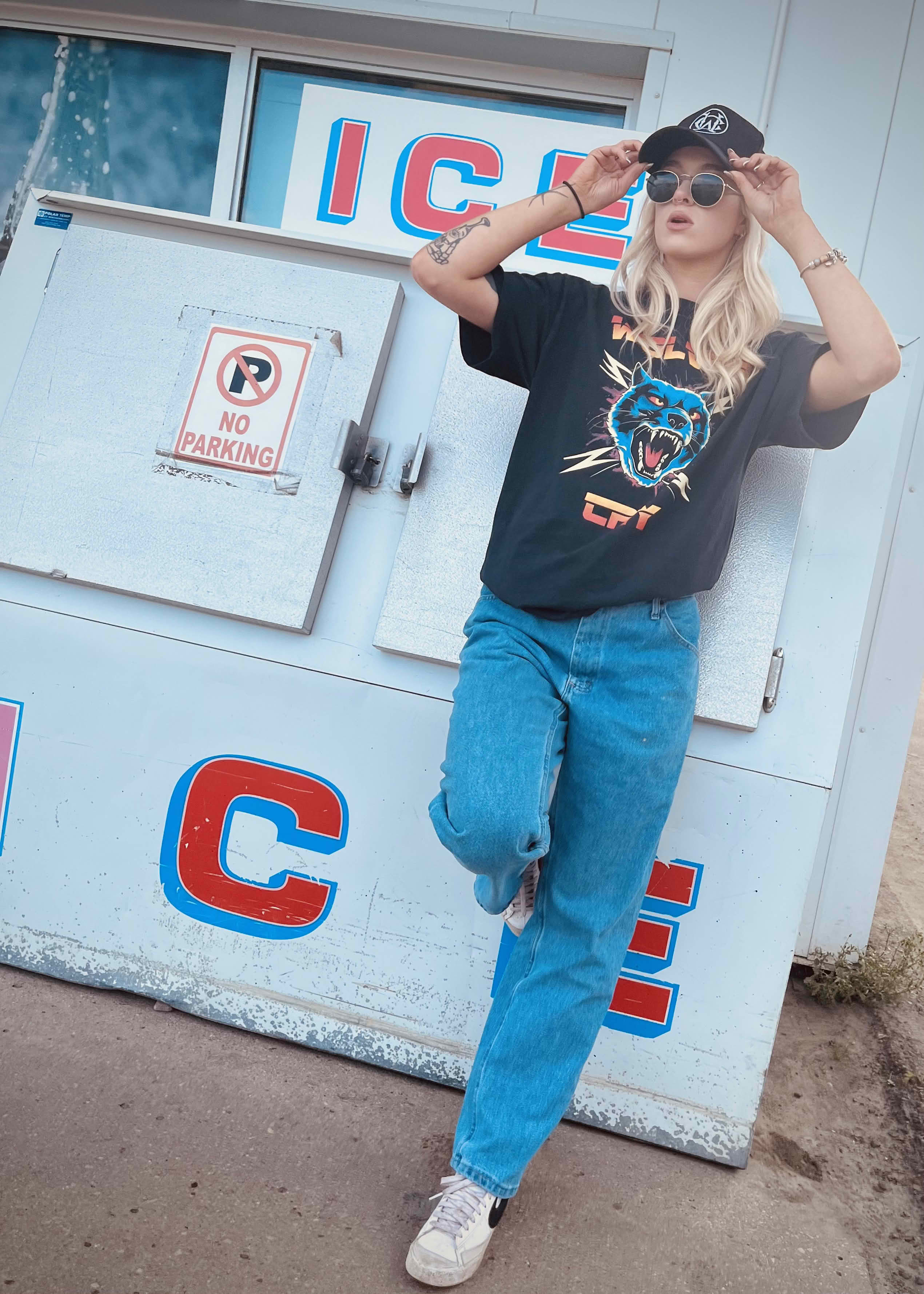 Thundercat Electro Tee by Wolves Cry, worn with blue jeans and sneakers, bold graphic streetwear shirt with punk edge and rebellious design