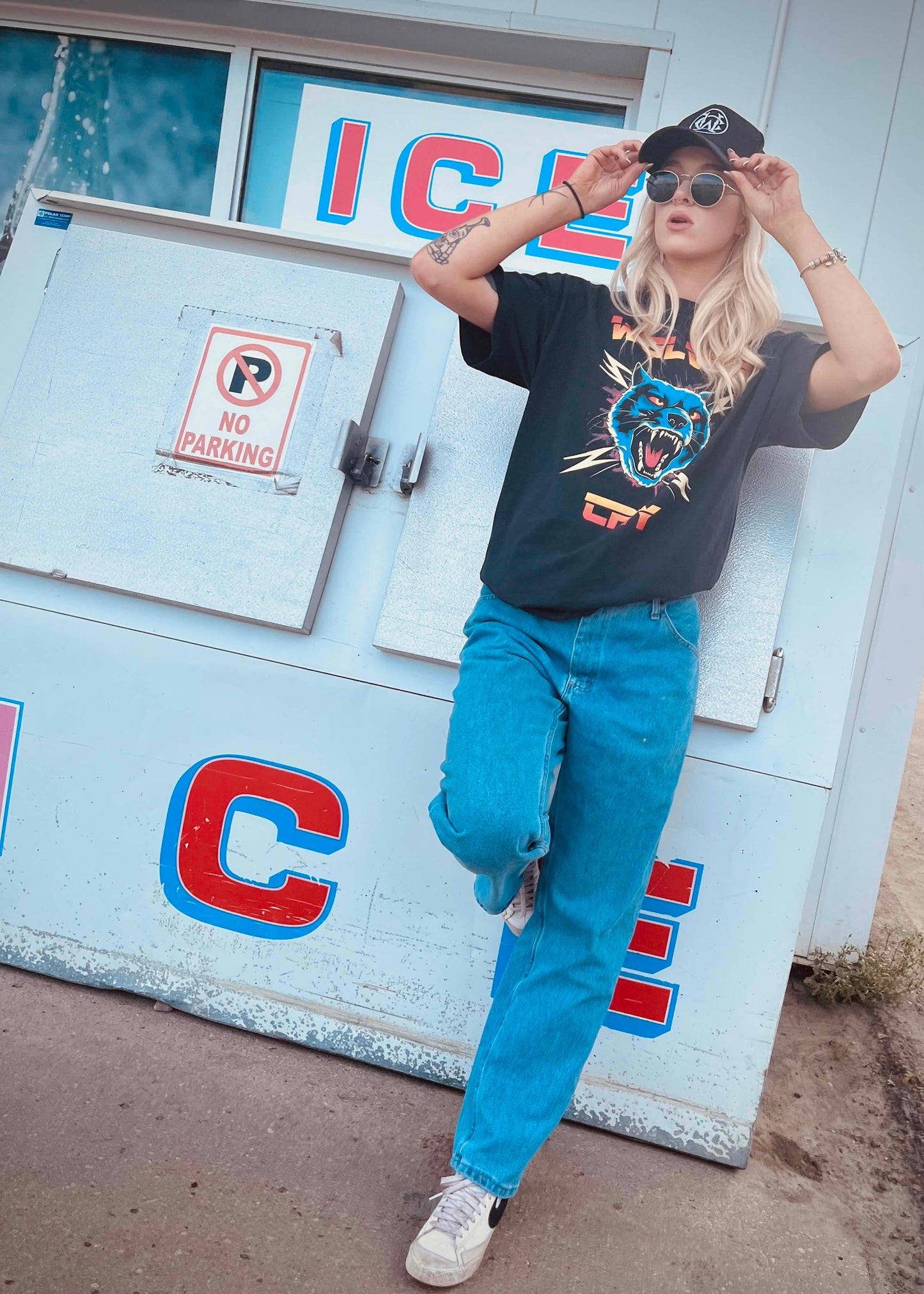 Thundercat Electro Tee by Wolves Cry, worn with blue jeans and sneakers, bold graphic streetwear shirt with punk edge and rebellious design