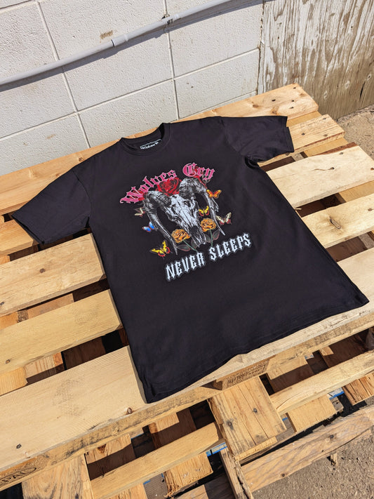 Flat lay of Wolves Cry DVNS Tee in black, showing full front print detail — vintage-inspired Wolves Cry artwork balanced with modern edge and bold contrast colors.