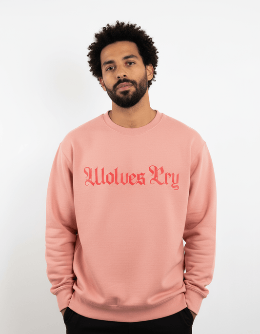 Model wearing Wolves Cry Everyday Crew in double coral — bright energy with soft, modern streetwear balance.