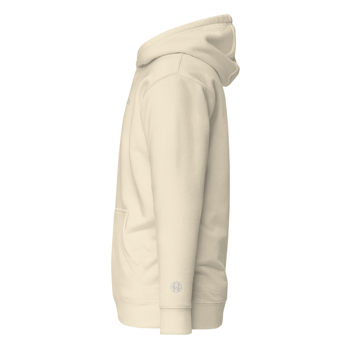 Side angle of Wolves Cry Everyday Hoodie in oatmeal, showing low-wrist WC monogram embroidery detail.