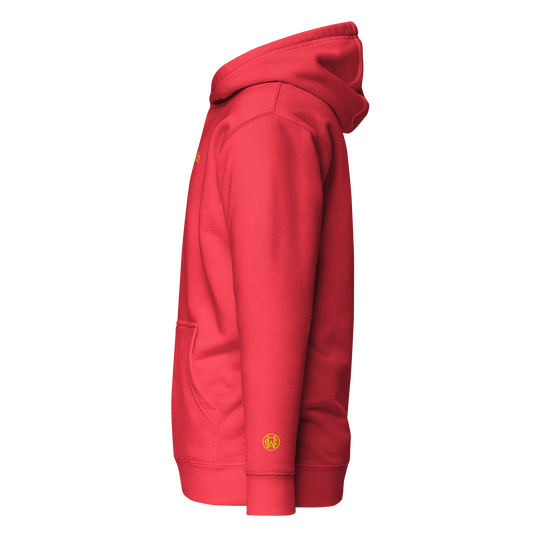 Side angle of red Wolves Cry Hoodie showing yellow monogram wrist embroidery for a sharp athletic finish.