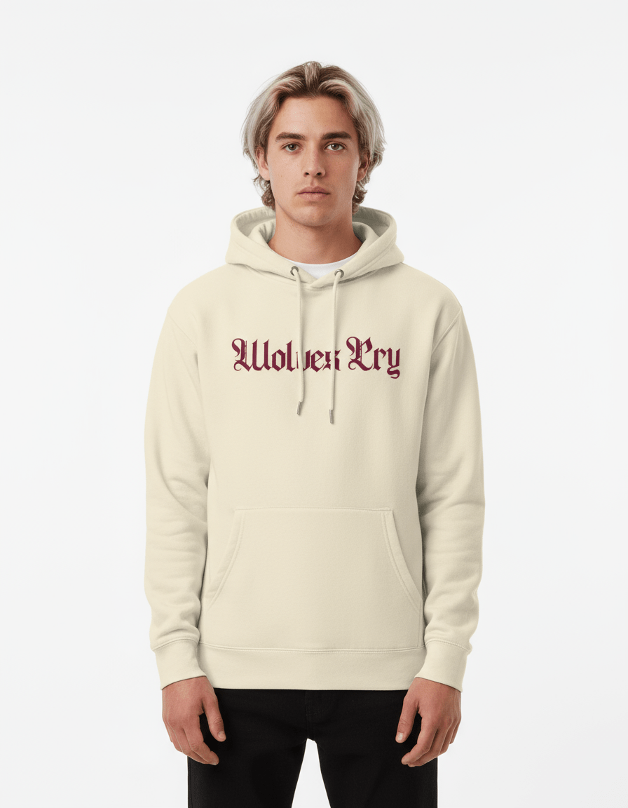 Model in Wolves Cry Everyday Spellout Hoodie in oatmeal and merlot — understated luxury meets Wolves Cry street heritage.