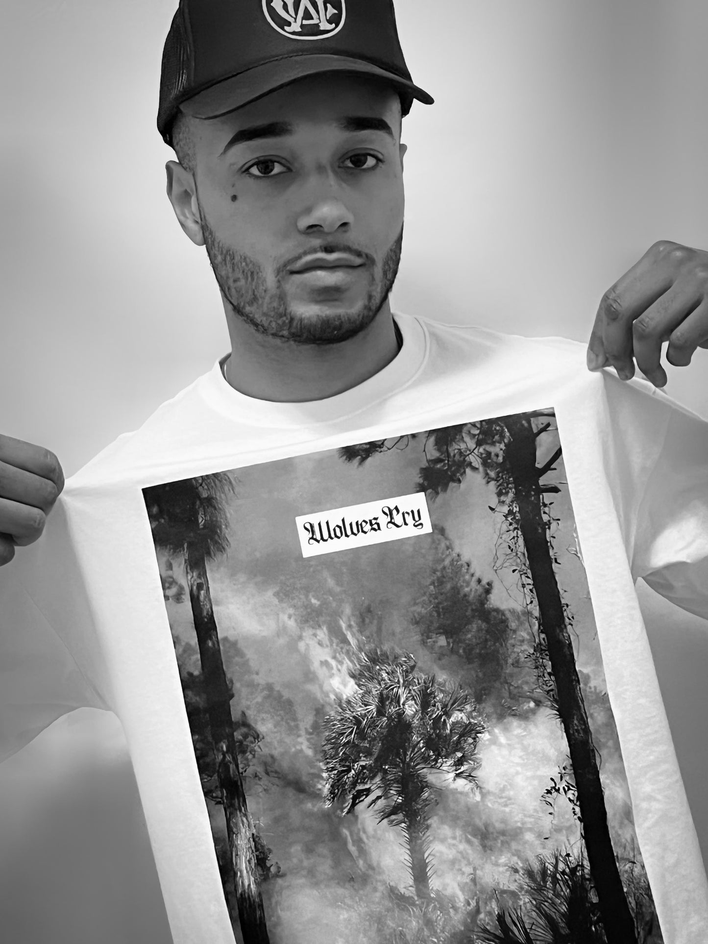 The Wolves Cry Malibu Flame Tee captured in a raw, real-world setting. A striking graphic design reflecting the balance between destruction and beauty.