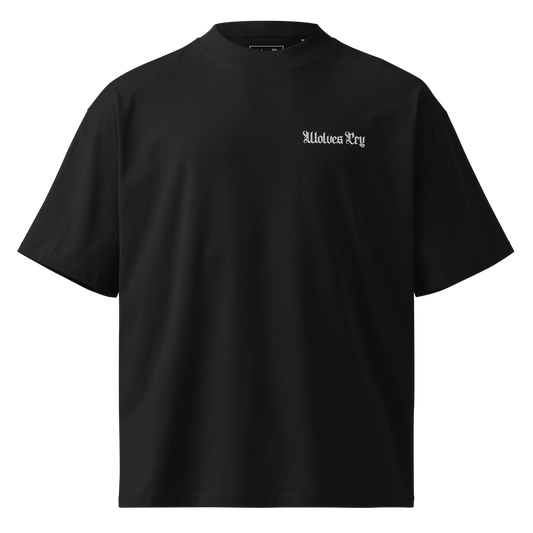 Organic black high neck drop tee flatlay showing oversized silhouette, heavyweight drape, and Wolves Cry embroidered logo.