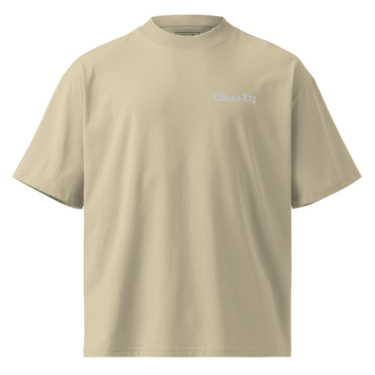 Flat lay of the Wolves Cry organic high neck drop tee in sage dust, a soft green-beige tone with tonal embroidery.