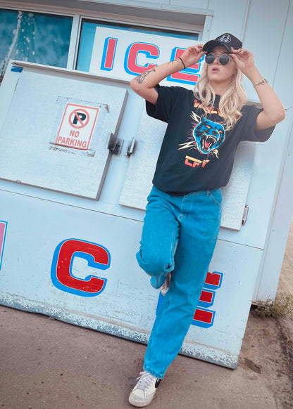 Thundercat Electro Tee by Wolves Cry, worn with blue jeans and sneakers, bold graphic streetwear shirt with punk edge and rebellious design