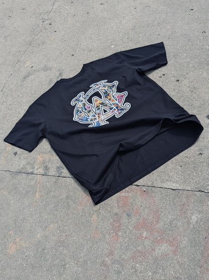 WC Shadow Floral Tee back flat lay showing floral WC monogram design on black cotton