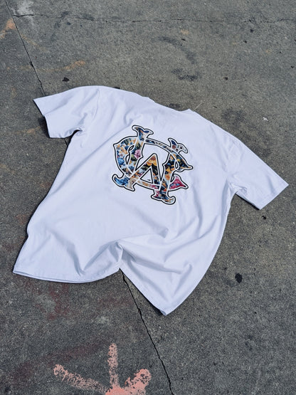 WC Shadow Floral Tee back flat lay in white showing detailed floral WC monogram