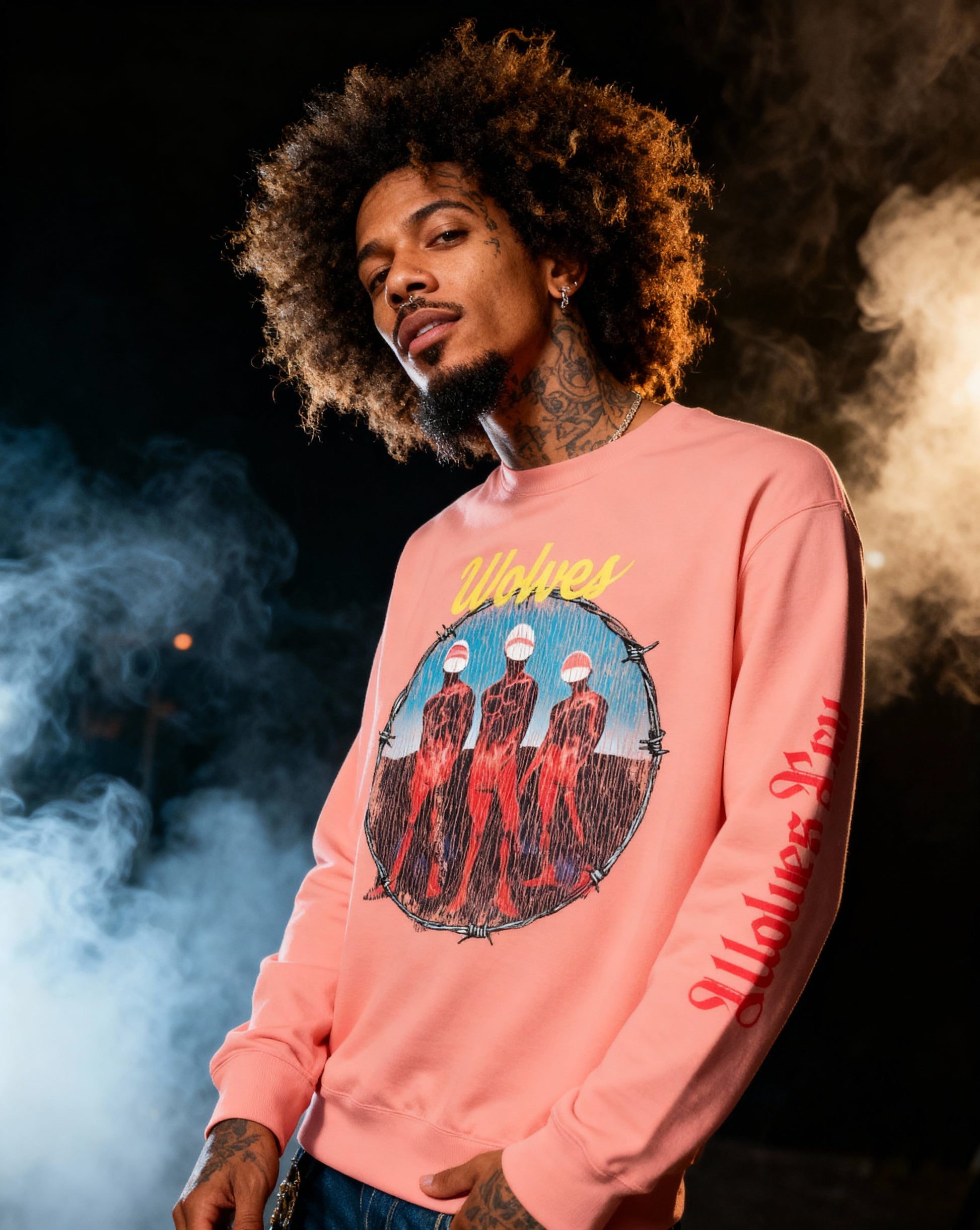 Model wearing the Wolves Cry Descendants crewneck in coral — vivid rock-band graphic with soft vintage-wash streetwear feel.