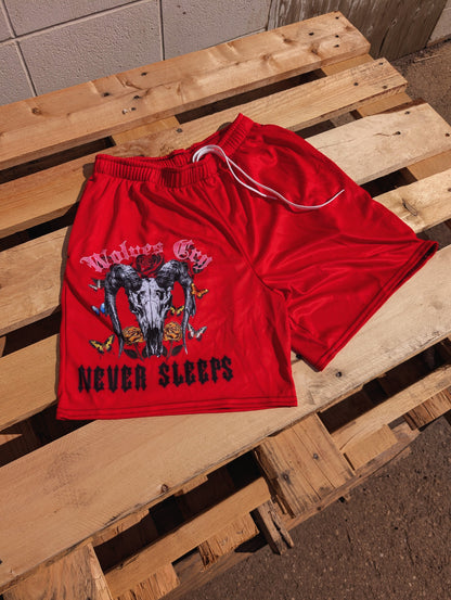 Flat lay of Wolves Cry DVNS Mesh Shorts in Red Edition — breathable mesh with Death Valley Never Sleeps artwork.