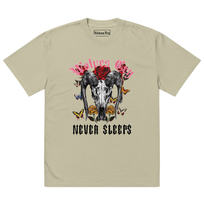 Front mock-up of Wolves Cry DVNS Tee in sage green — signature “Never Sleeps” skull and rose graphic printed on soft heavyweight cotton, inspired by Death Valley tones.