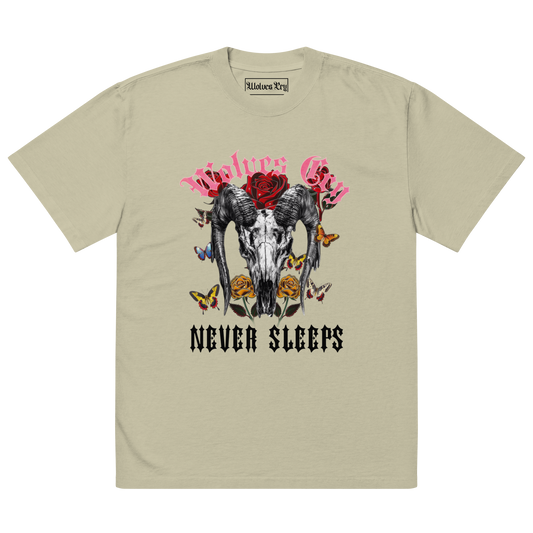 Front mock-up of Wolves Cry DVNS Tee in sage green — signature “Never Sleeps” skull and rose graphic printed on soft heavyweight cotton, inspired by Death Valley tones.