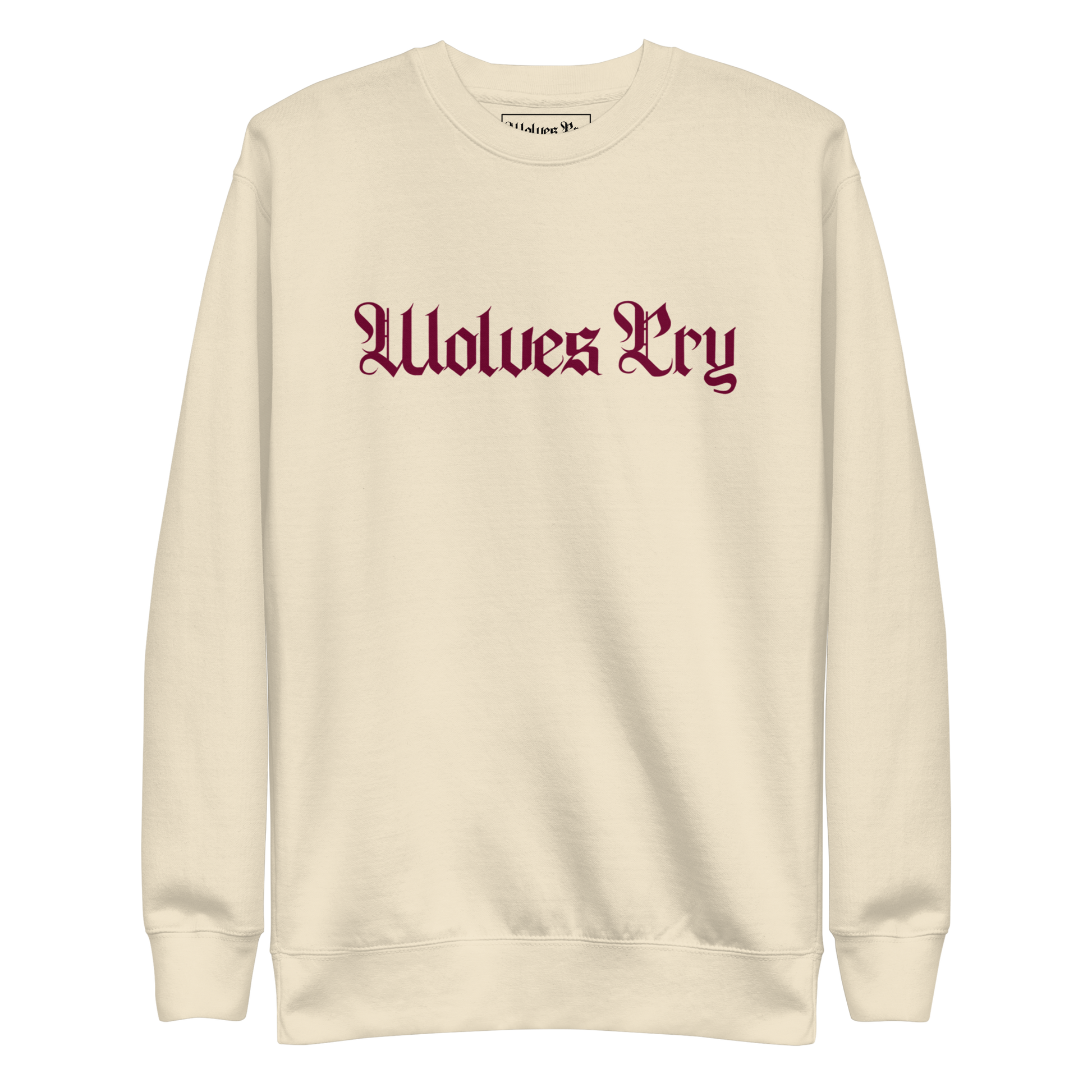 Front mock-up of Wolves Cry Everyday Crew in oatmeal with merlot embroidery — soft neutral base with rich contrast for timeless street refinement.