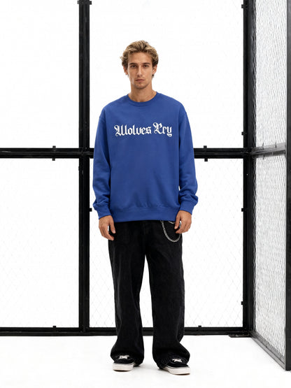 Model wearing Wolves Cry Everyday Crew in royal blue and white — classic athletic inspiration meets clean Wolves Cry minimalism.