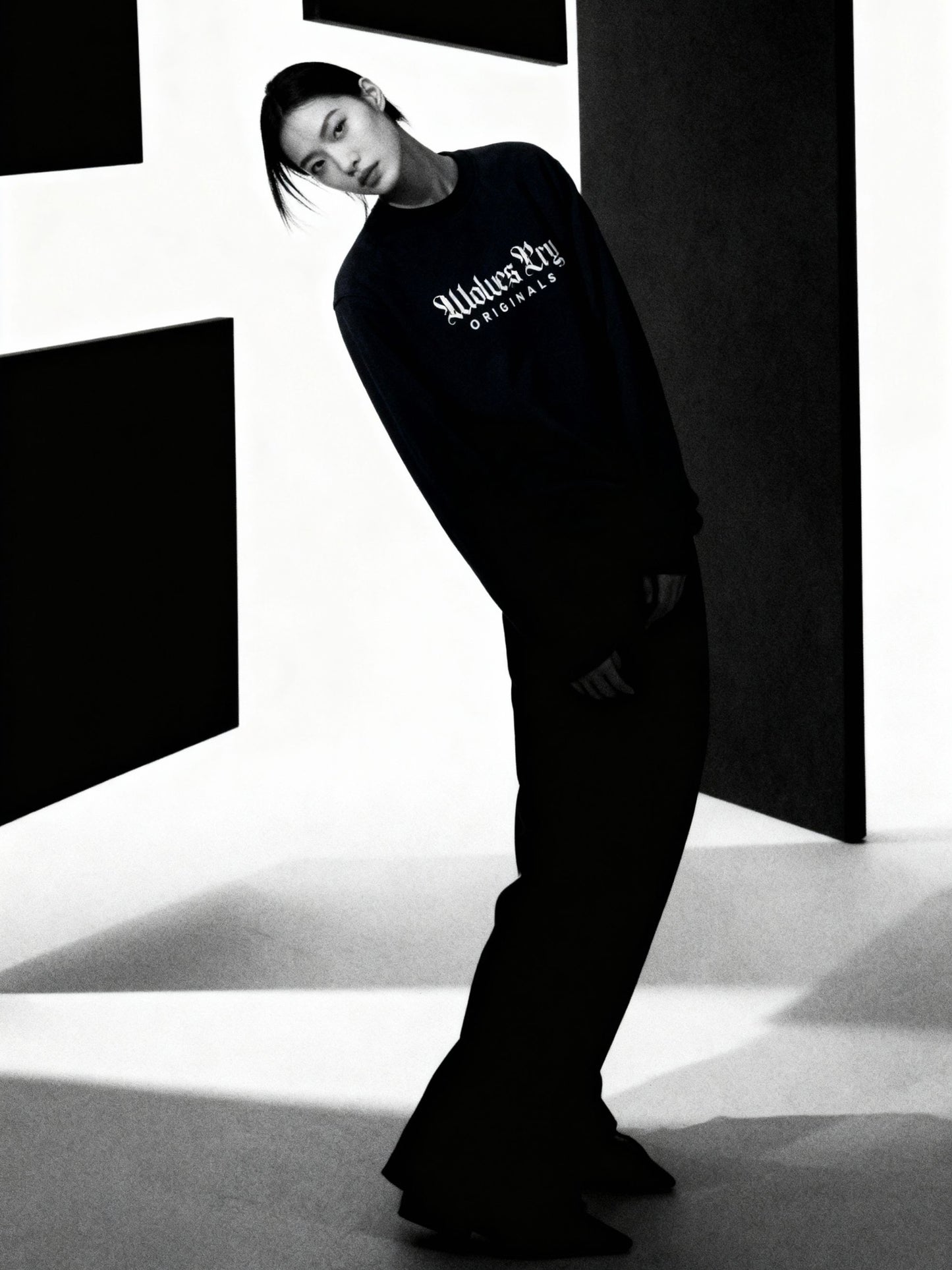 Model wearing Wolves Cry Embroidered Plain Jane Crew in navy, styled with casual streetwear fit and refined simplicity.