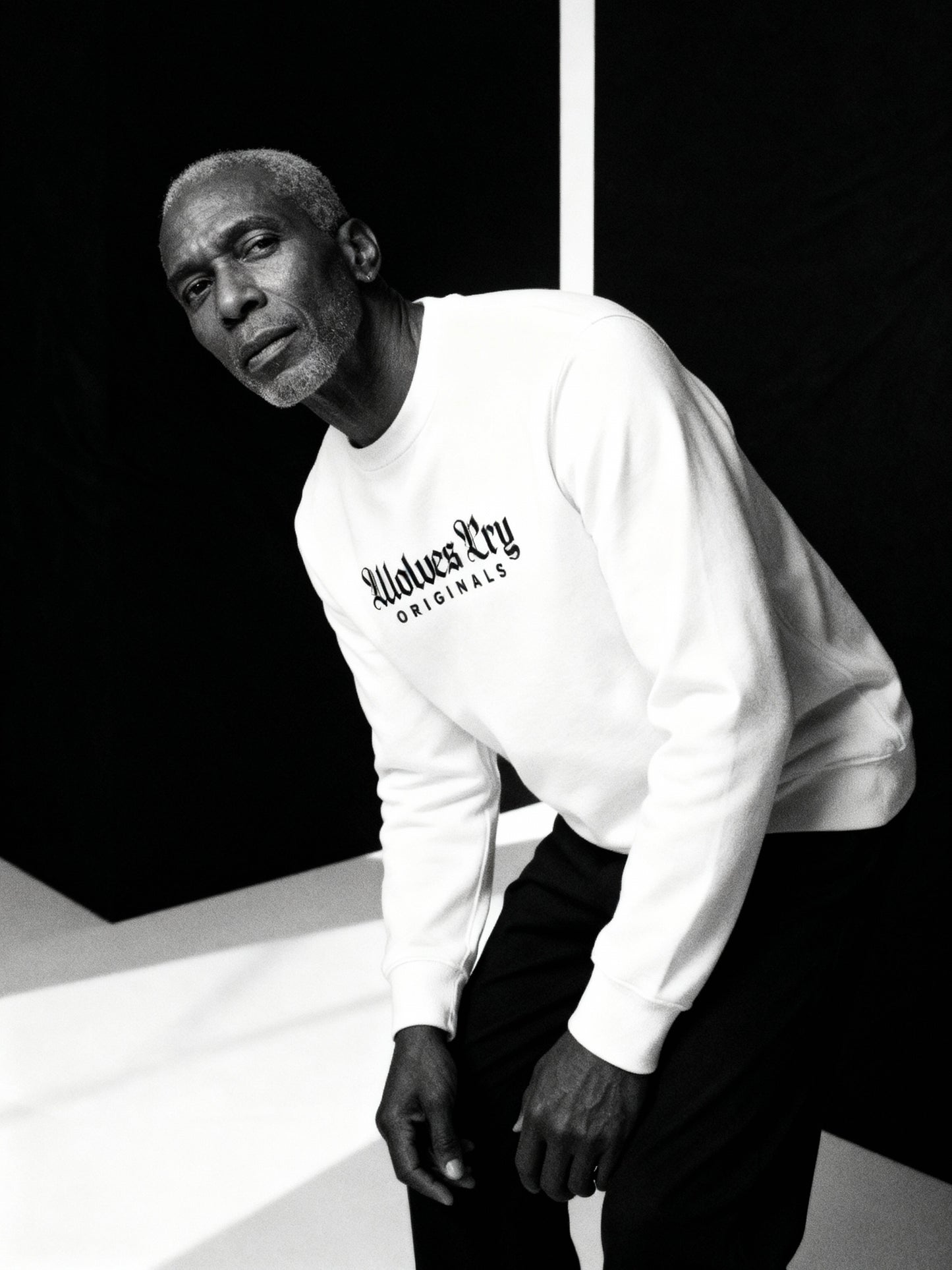 Wolves Cry Embroidered Plain Jane Crew in white captured mid-motion — showcasing effortless confidence and everyday luxury.