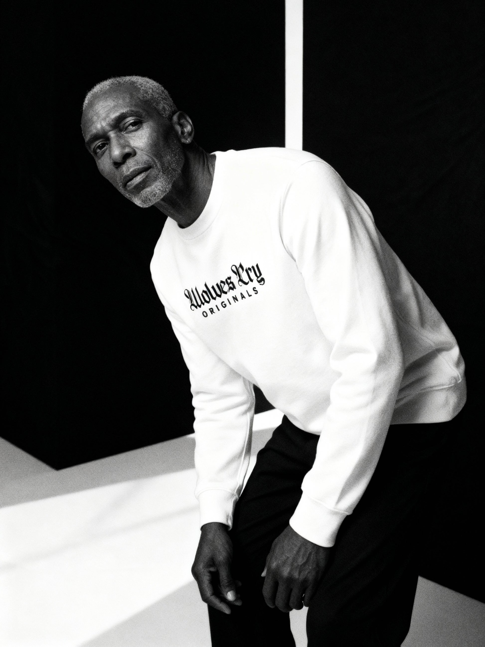 Wolves Cry Embroidered Plain Jane Crew in white captured mid-motion — showcasing effortless confidence and everyday luxury.