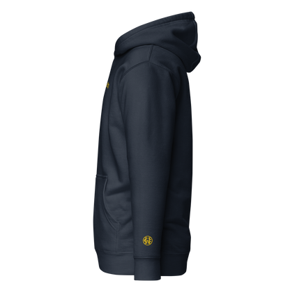 Side view of navy Wolves Cry Hoodie with yellow wrist monogram — balanced heritage energy.
