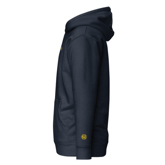Side view of navy Wolves Cry Hoodie with yellow wrist monogram — balanced heritage energy.