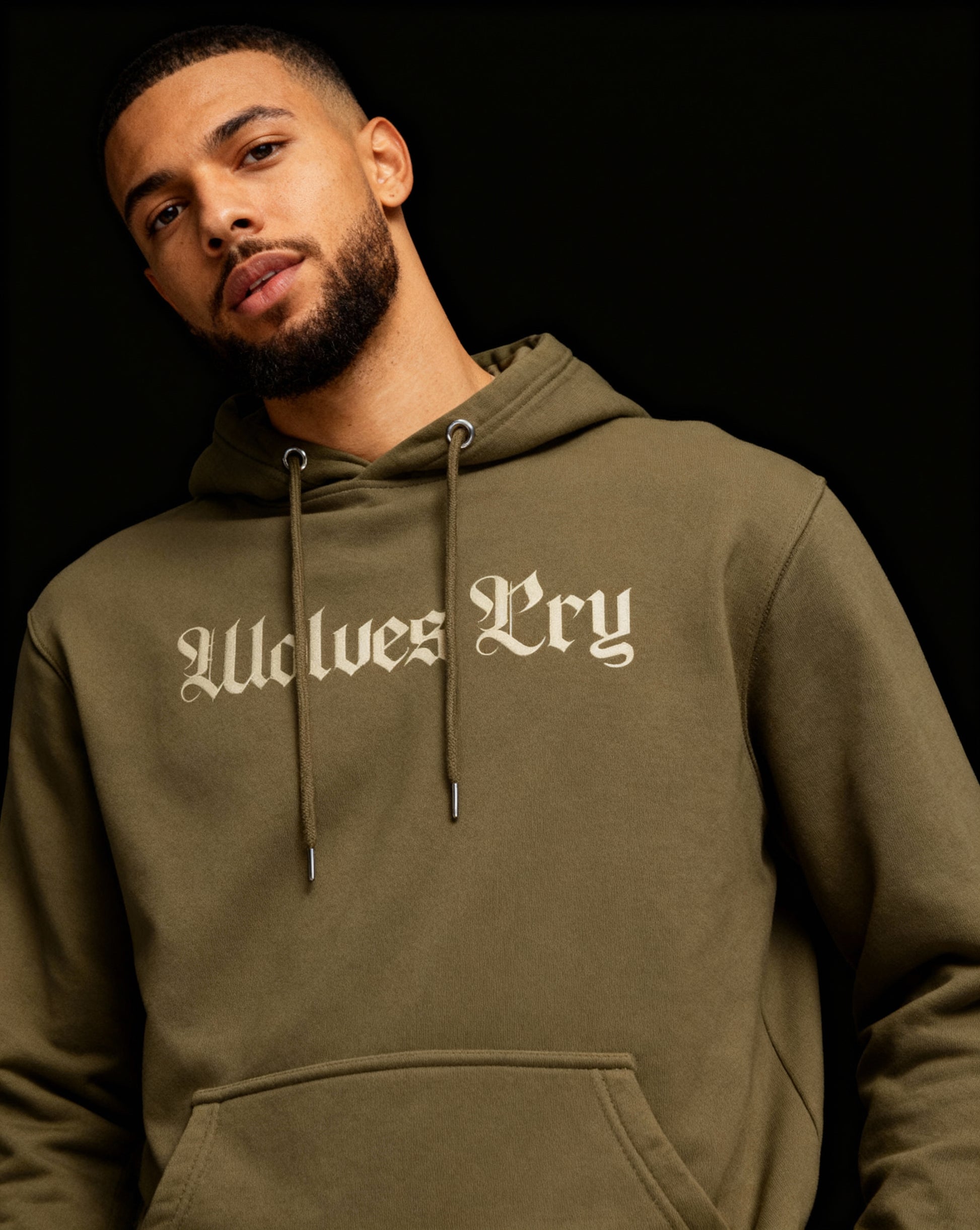 Close-up of Wolves Cry Everyday Spellout Hoodie in double olive — textured fabric and tonal stitching emphasizing craftsmanship and durability.