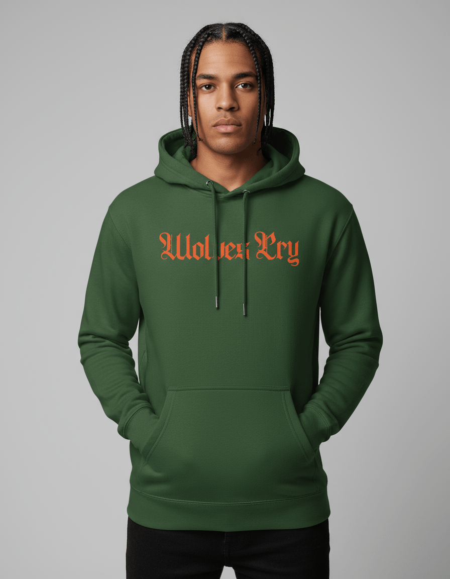 Model wearing Wolves Cry Everyday Spellout Hoodie in forest green with orange embroidery — blending athletic confidence with bold street energy.