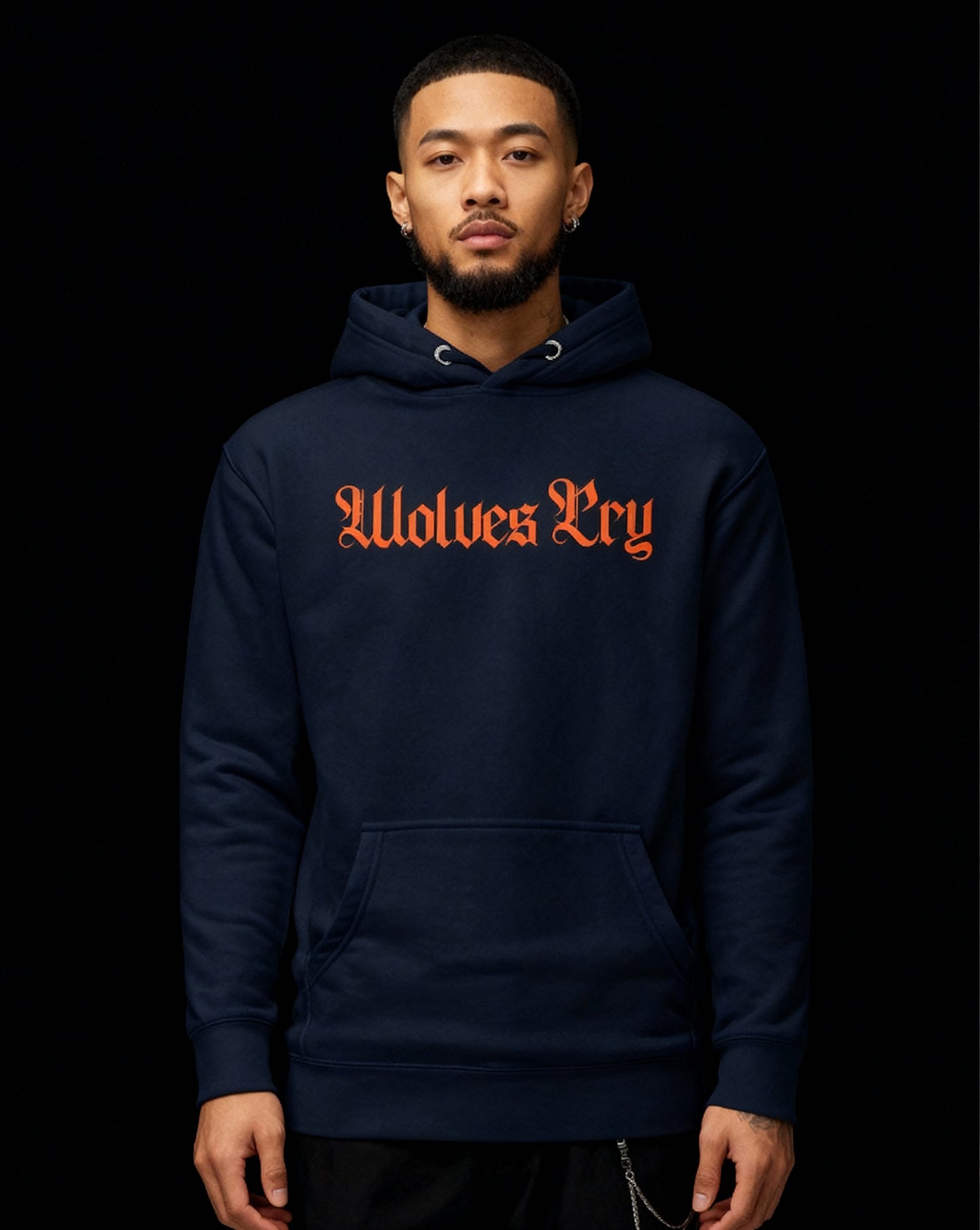 Wolves Cry Everyday Spellout Hoodie in navy and orange — bold contrast stands out under low light for an elevated street aesthetic.