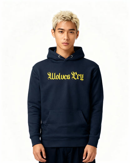Studio shot of model wearing Wolves Cry navy hoodie with yellow spellout logo — balanced streetwear silhouette with confident stance.