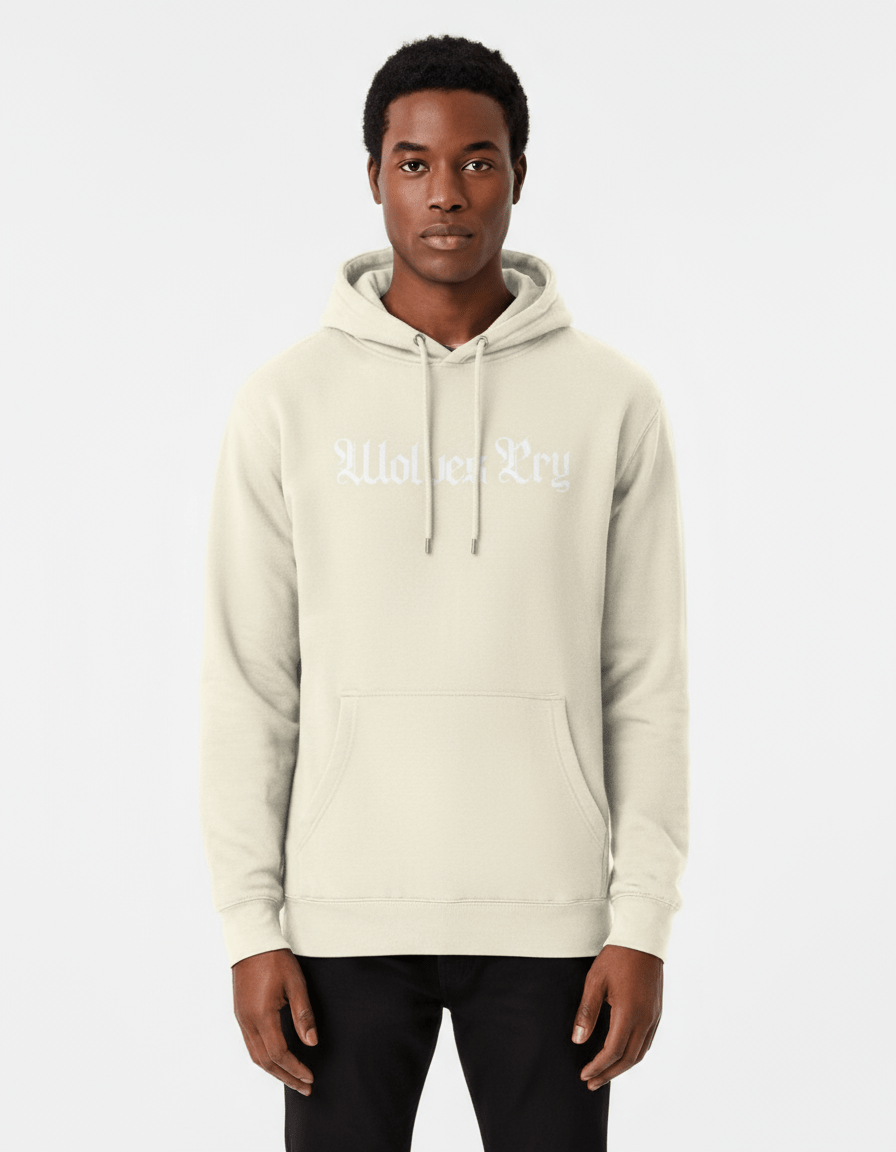 Model wearing Wolves Cry Everyday Spellout Hoodie in oatmeal and white — clean, neutral tones capturing effortless everyday style.
