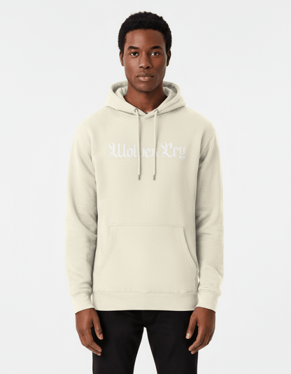 Model wearing Wolves Cry Everyday Spellout Hoodie in oatmeal and white — clean, neutral tones capturing effortless everyday style.

