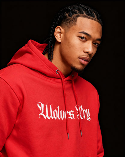 Close-up of Wolves Cry Everyday Spellout Hoodie showing white logo on vibrant red base, capturing premium texture and craftsmanship.