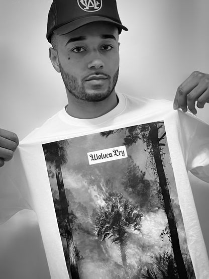 The Wolves Cry Malibu Flame Tee captured in a raw, real-world setting. A striking graphic design reflecting the balance between destruction and beauty.