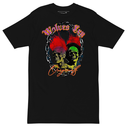 Mockup photo of Wolves Cry Megadeath Tee in black — worn by model outdoors, showcasing the bold skull-and-floral graphic print with red, yellow, and green highlights on heavyweight cotton.