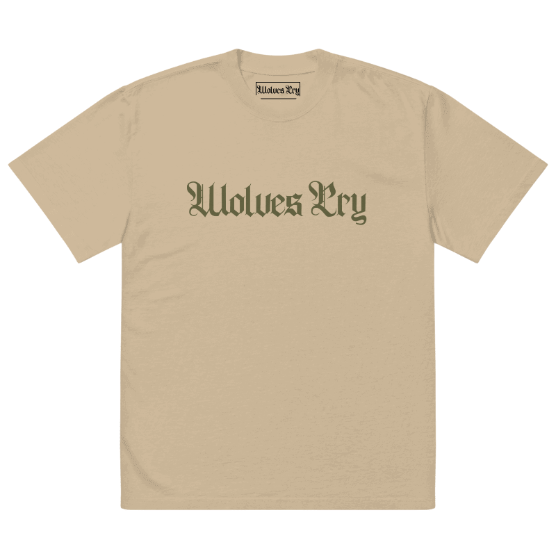Front view of Wolves Cry Oversized Vintage Wash Tee in khaki with olive camo spell-out logo — muted military-inspired streetwear essential.