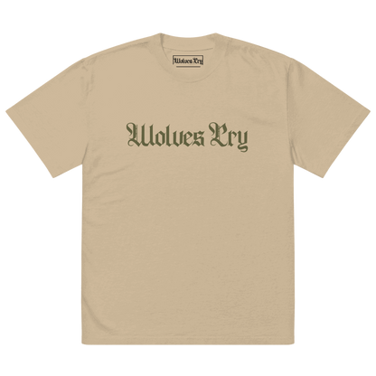 Front view of Wolves Cry Oversized Vintage Wash Tee in khaki with olive camo spell-out logo — muted military-inspired streetwear essential.