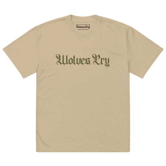 Front view of Wolves Cry Oversized Vintage Wash Tee in khaki with olive camo spell-out logo — muted military-inspired streetwear essential.